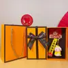 2025 Año de la Serpiente Tendencia Nacional Creativo Pequeña Serpiente de la Suerte Llavero Caja de Regalo Lindo Bolso Llavero Colgante Venta al por Mayor Pequeños Regalos
