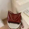 Bolso bandolera de cadena con patrón de rombos de alta gama transfronterizo 2026 nuevo moderno versátil para el trabajo bandolera bolso tote