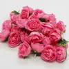 Venta caliente transfronteriza simulación pequeño capullo de té rosa flor de boda pared de flores flores decorativas cortina de cuentas diy cabeza de flor de rosa imitación Venta al por mayor