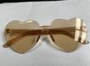 Gafas de sol sin montura en forma de corazón de color gelatina, Gafas de una sola pieza en forma de corazón, Colores deslumbrantes, Estilo transfronterizo