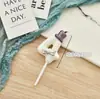 Vela digital transfronteriza con lindo moño rosa y decoración de sombrerito blanco para adorno de pastel de primera fiesta de cumpleaños