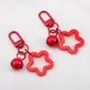 Llavero con Colgante de Campana de Estrella de Cinco Puntas de Colores Caramelo de Aleación Cubierta para Auriculares Decoración de Pareja
