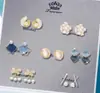 Nuevos Pendientes Estilo Retro Camelia Blanca Perla Fragante Aguja de Plata S999 Versátil Diseño de Nicho Clásico Mujer