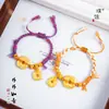 Pulsera trenzada Puzuo Color Fuerte Retención Arena Dorada Caqui Amuleto Estilo Tibetano Ajustable Estilo Étnico Pulsera de Raíz de Caqui