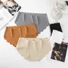 Ropa interior sin costuras de seda helada de cintura media con borde ondulado de color liso, ropa interior de una pieza ajustada para niñas y mujeres