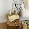 Bolsa de Verão Elegante com Bolinhas Feminina 2026 Nova Redonda Cilíndrica Boston Ombro Transversal Bolsinha de Mão Tendência Transfronteiriça