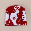 Novo chapéu de malha com estampa facial estilo europeu e americano transfronteiriço para homens e mulheres quente nicho personalidade casual chapéu de lã atacado