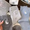 Calcetines largos de lunares caricatura japonesa perro pequeño calcetines holgados calcetines coreanos calcetines de media pantorrilla para mujer lazo ins en stock