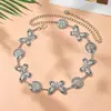 Cadena de cintura dorada tallada estilo étnico vintage transfronteriza, cinturón metálico con cadena de colgante redondo repujado estilo exótico para mujer