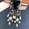 Aretes de Estilo Exótico de Venta Caliente Retro Literario Clásico Dignificado Ganchos para la Oreja Versátil Hueco Moda Borla Colgantes