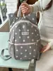 Mochila de lunares transfronteriza, mochila casual y ligera para viajes al aire libre, mochila ligera de gran capacidad para la escuela y el trabajo para estudiantes de secundaria y preparatoria.