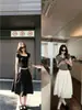 'Falda de Ballet Relajada' - Un estilo ligero, casual y relajado con una cintura ancha y un dobladillo elegante y voluminoso, falda de longitud media