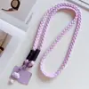 Cordón cruzado para teléfono móvil, cadena para colgar con diseño de dibujos animados tejido a la moda, con clip, funda para teléfono móvil fuerte y duradera, cordón anti-pérdida