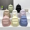 2025 Nova Mochila Pequena Cor Doce Fresca Mochila Simples Estilo Japonês Cor Pura Versátil Estudante Grande Capacidade Mochila Escolar