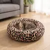 Cama para Gatos Redonda de Peluche Suave y Esponjosa con Forma de Donut Gris Calmante Lavable