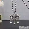Explosiones en Vivo Estilo Étnico Corre en el Tiempo Cadena de Lana de Flor Collar Largo Plata de Xizang Candado de Larga Vida Colgante de la Riqueza del Cuarteto