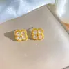 Conjunto de Colar e Brincos Fashionable Transfronteiriço com Zircônia Incrustada Conjunto de Duas Peças Trevo de Quatro Folhas Totalmente Diamantado Versátil Joias de Luxo Leve