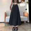 Foto real de falda de lana estilo coreano para otoño/invierno 2026, de cintura alta, que cubre la cadera, adelgazante, de longitud media, con estampado de estrellas, línea A