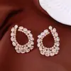 Pendientes de borla con flor de trébol de circonita vintage con un toque de alta gama, pendientes versátiles y de moda al por mayor