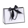 Bolsa de papel portátil con lazo de color, de fondo cuadrado, con embalaje exquisito, para regalo, ropa, compras, logotipo imprimible.