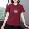 Moda Verão 2026 Elegante e Estiloso Redutor de Idade Tamanho Plus Size Solto Gola Redonda Manga Curta Regular Camiseta para Mulheres