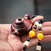 Al por mayor tallado de palo de rosa pieza de mango de mano perro salvaje valiente mango olla colgante Hu adornos tiembla artículos vivos manualidades regalos
