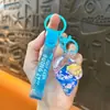 Llavero creativo de concha pequeña con aceite, lindo colgante pequeño de arena movediza líquida, accesorios para bolso, pequeño colgante de regalo, venta al por mayor