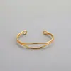 Pulsera de anillo de Mobius para mujer, ola simple, pulsera versátil, celebridad de Internet, Mori, abierta, color electrochapado, protección de color, oro de 18 quilates
