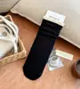 Meias de renda com babados de comprimento médio para outono e inverno no atacado, meias femininas de cor sólida estilo faculdade japonesa