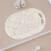 Tapete de Chão Oval Simples Estilo Coreano de Lama Diatomácea Absorção de Água Secagem Rápida Tapete para Pés Banheiro Tapete para Pés Vaso Sanitário Antiderrapante Luxo Leve Pontos Tapete de Entrada