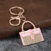 Llavero de bolso con incrustaciones de diamantes, colgante de bolso pequeño totalmente de diamantes, decoración de bolso estilo lujo ligero, llavero, venta al por mayor de regalos pequeños