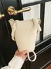 Bolsa Pequeña para Mujer de Marca Extranjera Súper Popular Modelo Nuevo 2026 Bolso para Teléfono de Nicho Bolso Cubo Bolso de Hombro Cruzado Versátil y Elegante