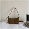 Bolso de mano pequeño cuadrado casual estilo coreano para mujer, nuevo modelo otoño 2026, simple y elegante, con colores contrastantes y alto atractivo estético, se puede llevar al hombro o cruzado