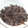 Té Pu'er de Yunnan al por mayor 2006 Montaña Marrón palacio té Pu'er cocido primavera pastel de siete semillas