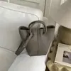 Bolso de Mano de Textura Moda y Sencillo, Bolso Cubo para Mujer, Nuevo Estilo Invierno 2025, Lujo Ligero, Bolso de Hombro y Cruzado Elegante y Versátil