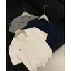 Suéter de Tricô Elegante com Gola Polo Estilo Comuter Novo para Mulheres Estilo Coreano Ombro Normal Manga Curta Slim Fit Top