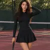Mono de tenis de estilo europeo y americano más vendido, de manga larga con media cremallera en color marrón oscuro, para fitness al aire libre, con pantalones cortos de seguridad incorporados
