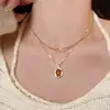 Collar apilable con colgante ovalado de ámbar para mujer, Lujo accesible, Cadena de suéter de nicho moderna y de alta gama, Accesorios de collar elegantes