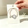 Pulsera de Cuentas Cerámicas de Camelia de Disco Redondo con Reloj de Cuarzo para Mujer, Estilo Bosque, Alto Valor Estético, Amigable para Estudiantes, Exquisito Reloj de Cuarzo
