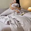 Juego de ropa de cama de cuatro piezas de jacquard cepillado con relieve 100% algodón, uso doméstico de alta gama, suave y amigable con la piel, incluye sábana bajera, sábana encimera y funda de edredón