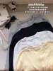 Camiseta de manga larga con cuello redondo minimalista estilo coreano para mujer, elástica, ajustada y estilizada, perfecta para principios de otoño, top versátil de color liso para usar como capa base
