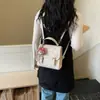 Mochila de mano linda, elegante y exquisita para mujer, nuevo modelo 2026, mochila de moda de nicho, estilo universitario, bolsa escolar pequeña para el día a día