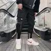 Pantalones de hip-hop para hombre, primavera y otoño, nuevos, personalizados, pantalones con cinta, tendencia, overol Joker para pies de hombre, una generación de pelo