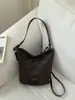 Bolso de axila tejido de patrón retro de nicho, bolso tipo cubo para mujer, nuevo bolso de hombro cruzado de gran capacidad popular de moda 2026