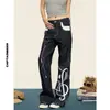 Parche de cuero bordado nota asiática fría mezclilla cruda pierna recta pierna ancha callejera ligera jeans color original patrón de conejo negro
