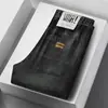 Calça jeans de sarja elástica para primavera e outono, estilo coreano slim fit, marca da moda, bordado simples, calça casual moderna e versátil para homens