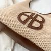 Bolsa de design vazado nicho para mulheres 2024 nova moda bolsa de ombro de palha versátil bolsa de palha trançada para axila