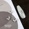 Novos designs de nail art com adornos de zircônia cúbica de alta qualidade, leves e luxuosos, incluindo strass nas pontas dos dedos estilo francês, decorações de unha versáteis e deslumbrantes, e motivos de coração e borboleta