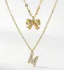 Collar Colgante con Lazo y Letra Diamantada Transfronterizo Europeo y Americano para Mujer Cadena de Clavícula Multicapa Venta al por Mayor