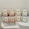 Mochila de mujer fresca y dulce, moderna y versátil, mochila con estampado de dibujos animados lindos, nuevo modelo 2026, bolso cruzado, bolso para el trabajo